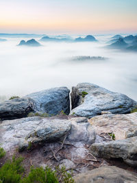 Scenic view of rocks in mountains against sky