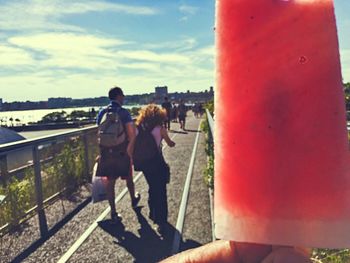 Woman standing against sky