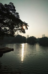 Scenic view of lake against sky during sunset