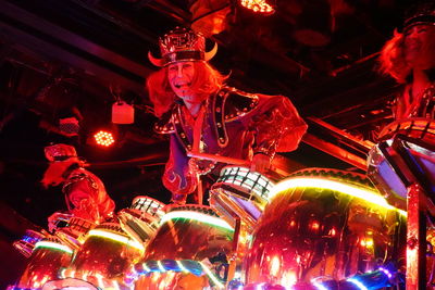 Low angle view of illuminated lanterns hanging at night