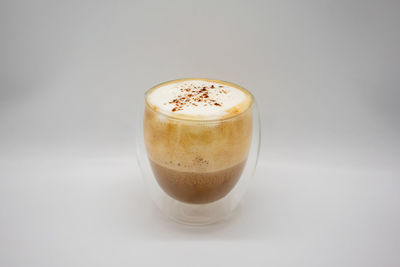 Close-up of coffee cup against white background
