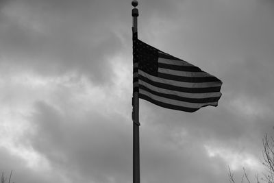 Low angle view of flag against sky