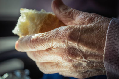 Close-up of hand holding ice cream