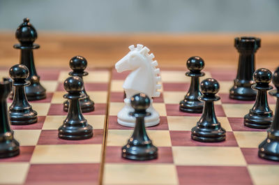 Close-up of chess pieces on table