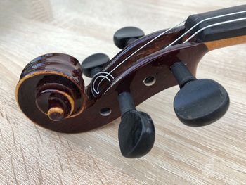 Close-up of violin on floor