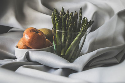 Close-up of fruits in bowl on table at home