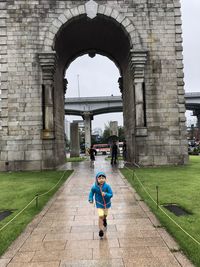 Boy in front of the arc de triomphe of korea