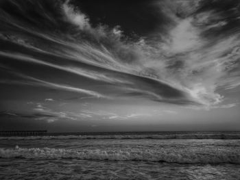 View of calm sea against cloudy sky