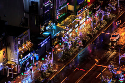 High angle view of illuminated city street at night