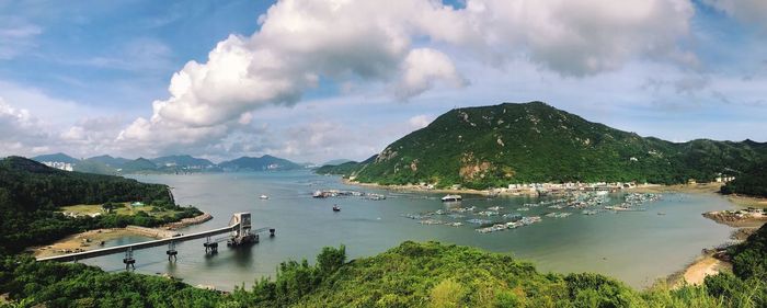 Panoramic view of lamma island against cloudy sky