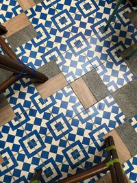 High angle view of people on tiled floor