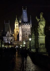 View of statue in city at night