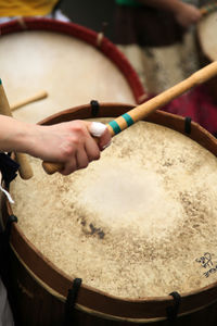 Cropped image of hand playing drum