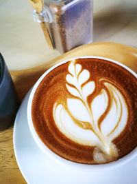 Close-up of cappuccino on table