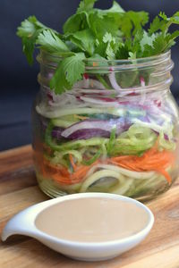 Close-up of juice in glass jar on table