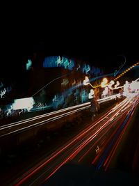 High angle view of light trails on road at night