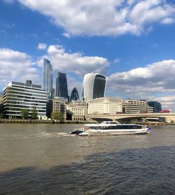 Buildings in city against sky