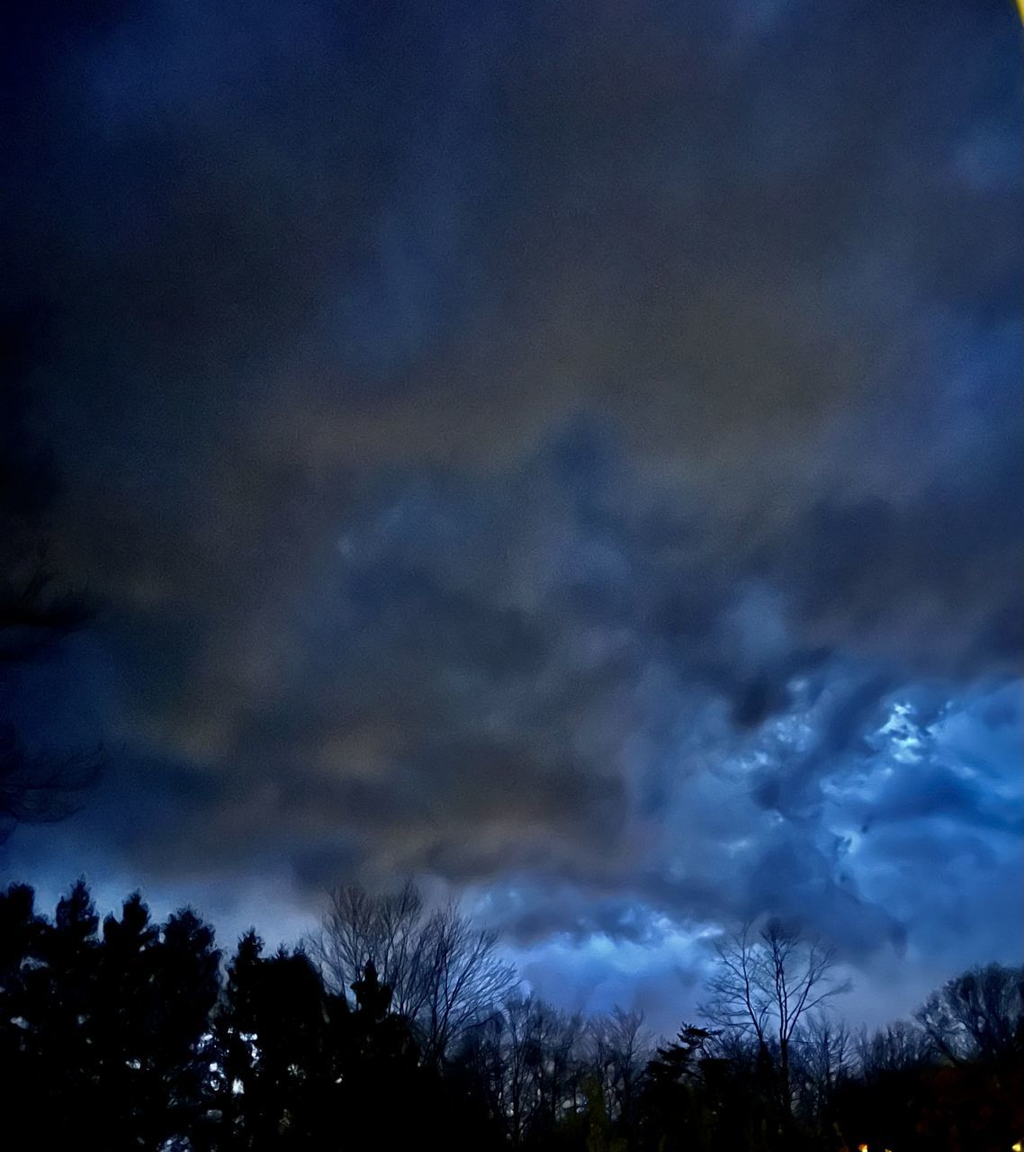 sky, cloud, tree, beauty in nature, darkness, plant, night, scenics - nature, nature, silhouette, no people, storm, dramatic sky, tranquility, evening, low angle view, dusk, tranquil scene, environment, dark, outdoors, illuminated, thunder, storm cloud, overcast, cloudscape, thunderstorm, blue, atmospheric mood