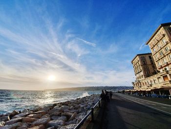 Panoramic view of sea and buildings against sky