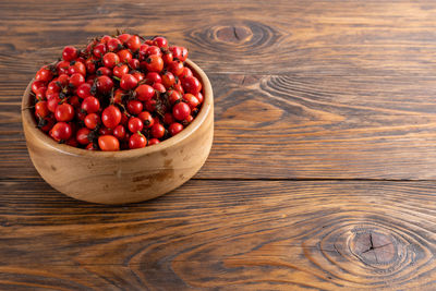 High angle view of strawberries in bowl on table