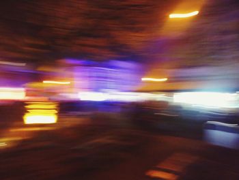 Blurred motion of car on street at night