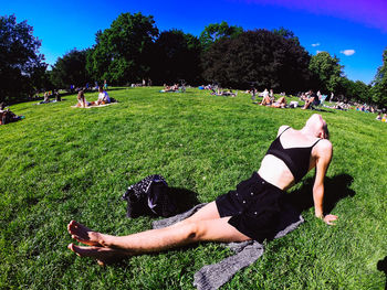 People relaxing on field