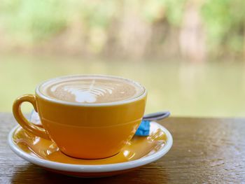 Close-up of coffee cup on table