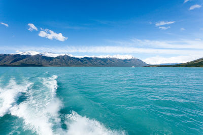 Scenic view of sea against blue sky