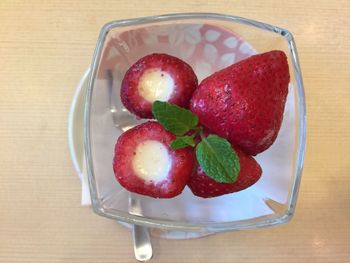 High angle view of strawberries in glass on table