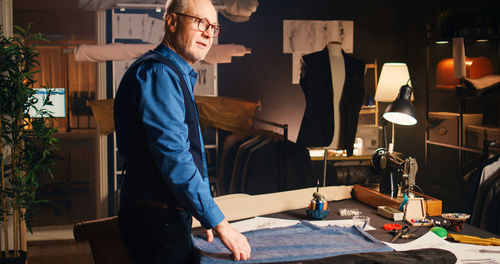 Side view of young man working at office