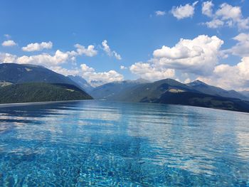 Scenic view of swimming pool by sea against sky