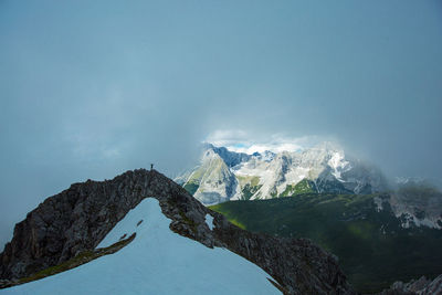 Low angle view of mountains against blue sky