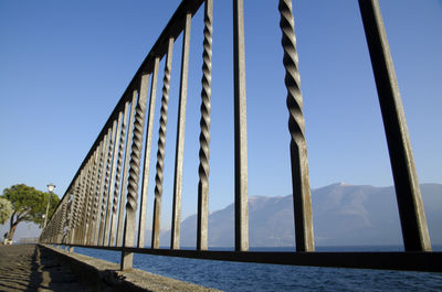 Low angle view of bridge over river against sky