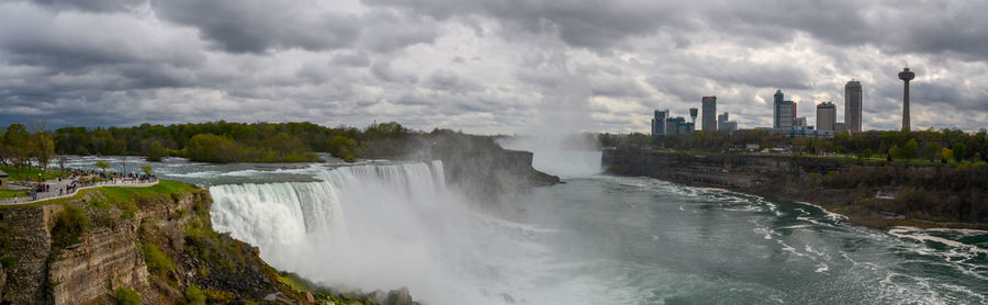 Panoramic view of waterfall against sky