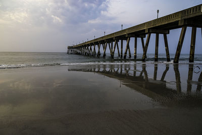 Pier over sea against sky