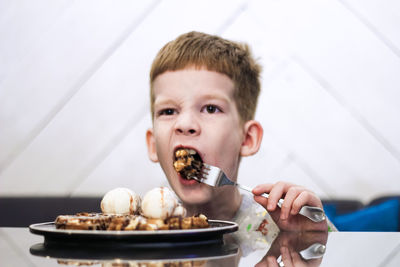 Portrait of boy eating food