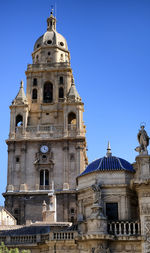 Low angle view of building against blue sky