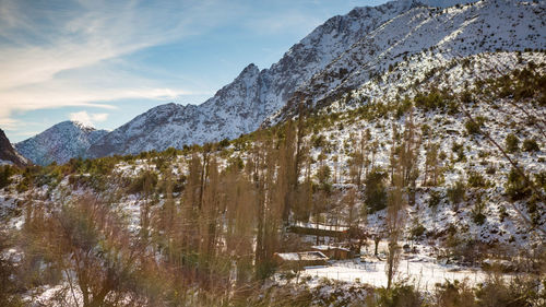 Scenic view of mountains against sky during winter