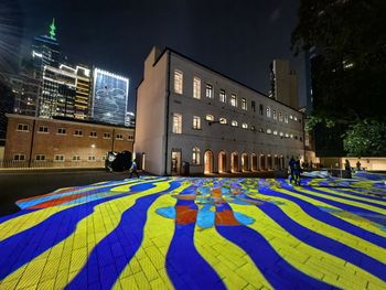 Illuminated buildings in city at night