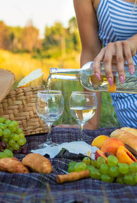 Midsection of woman preparing food at market stall