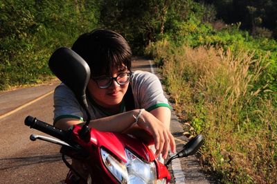 Man looking away while sitting on motorcycle