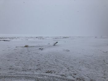 Scenic view of sea against sky during winter