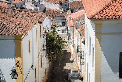Street amidst houses and buildings in city