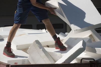 Low section of man working at construction site