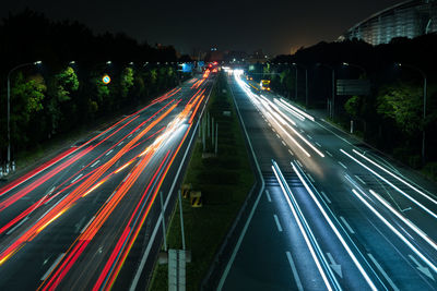 High angle view of light trails on road at night