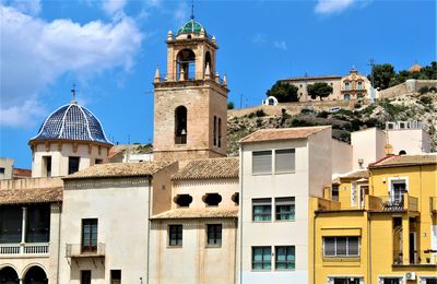 Low angle view of buildings in city against sky