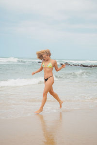 Full length of woman on beach