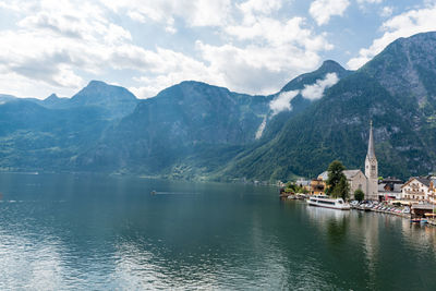 Scenic view of lake and mountains against sky