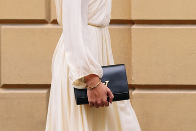 Midsection of woman holding gift