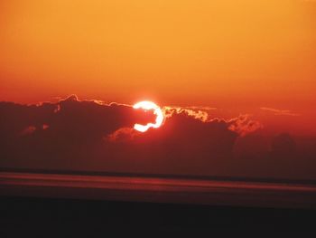 Scenic view of sea against orange sky